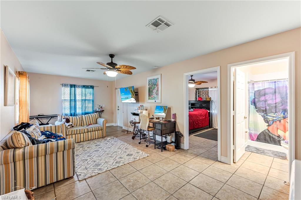 724 Pine Cone Lane Naples, FL 34104 - Photo 32 of 45 a living room with furniture