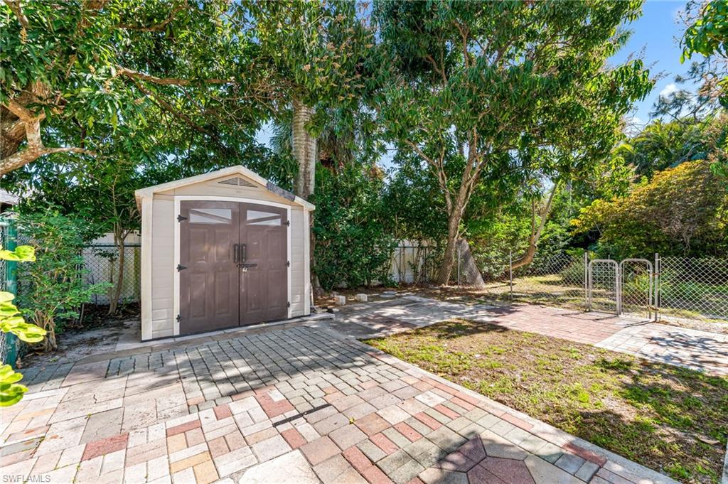 724 Pine Cone Lane Naples, FL 34104 - Photo 37 of 45 a view of a backyard