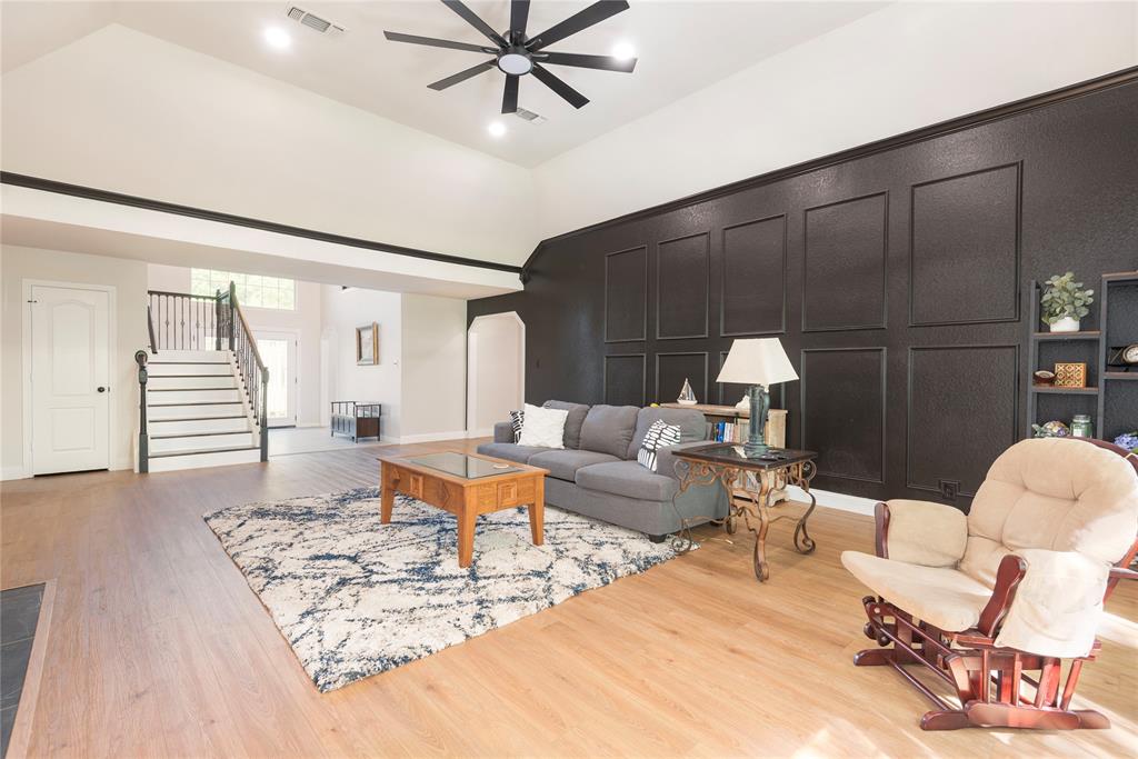 2020 Arbor Bend Road Bonham, TX 75418 - Photo 17 of 40 Living room featuring arched walkways, light wood finished floors, ceiling fan, recessed lighting, and vaulted ceiling