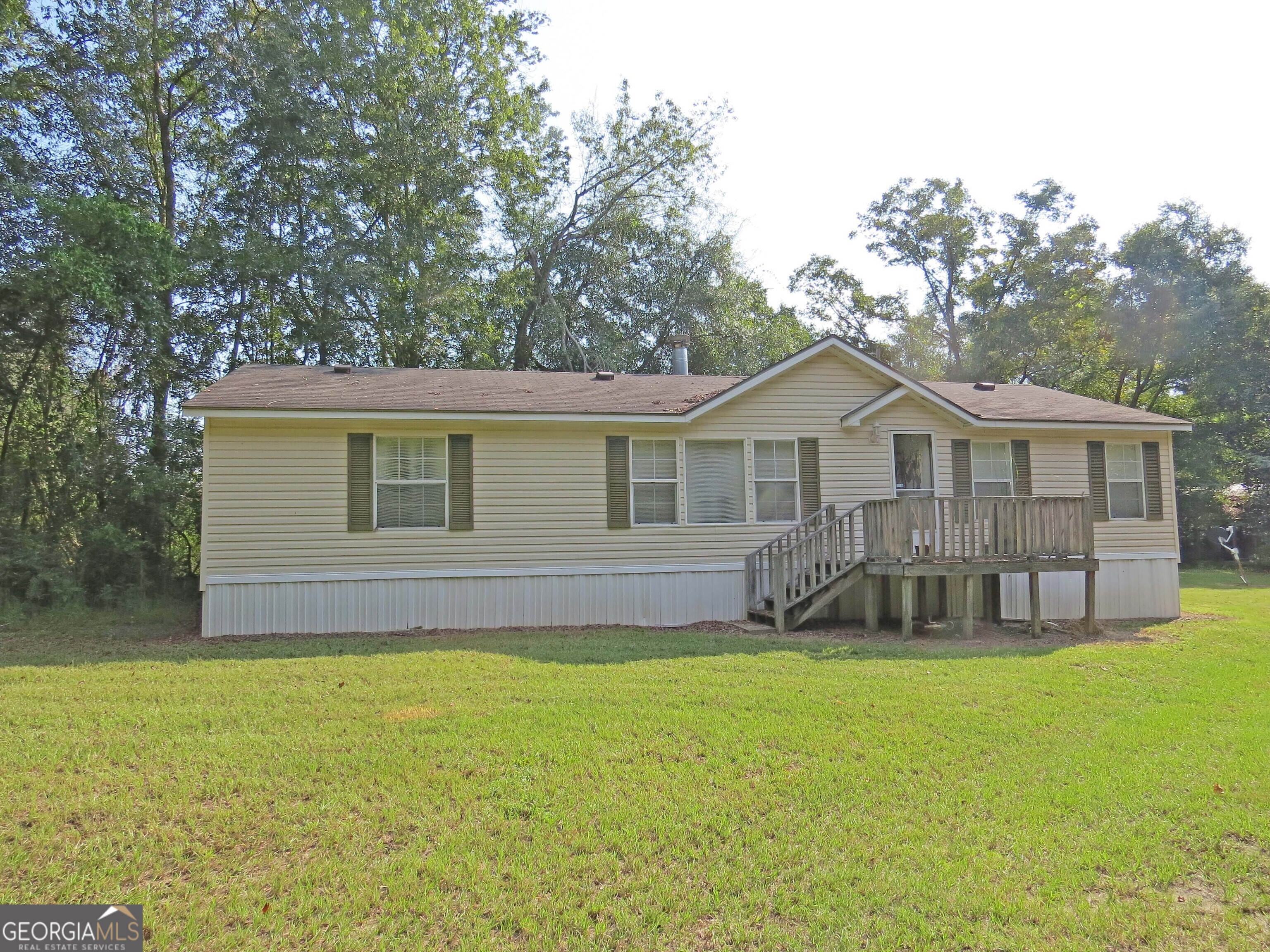 241 Mount Galilee Church Road Jacksonville, GA 31544 - Photo 14 of 19 a front view of a house with a garden and yard