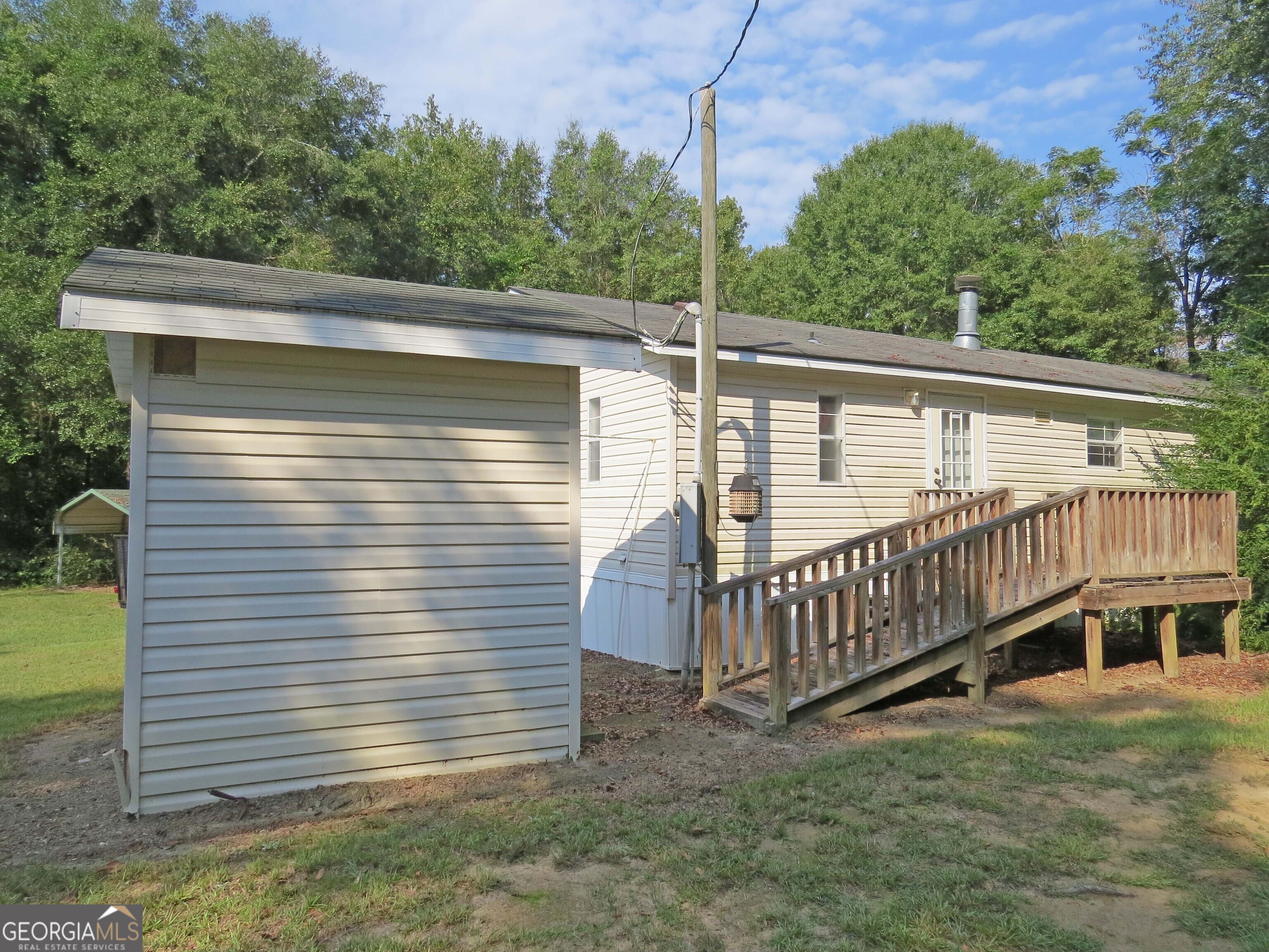 241 Mount Galilee Church Road Jacksonville, GA 31544 - Photo 16 of 19 a view of a yard with a deck