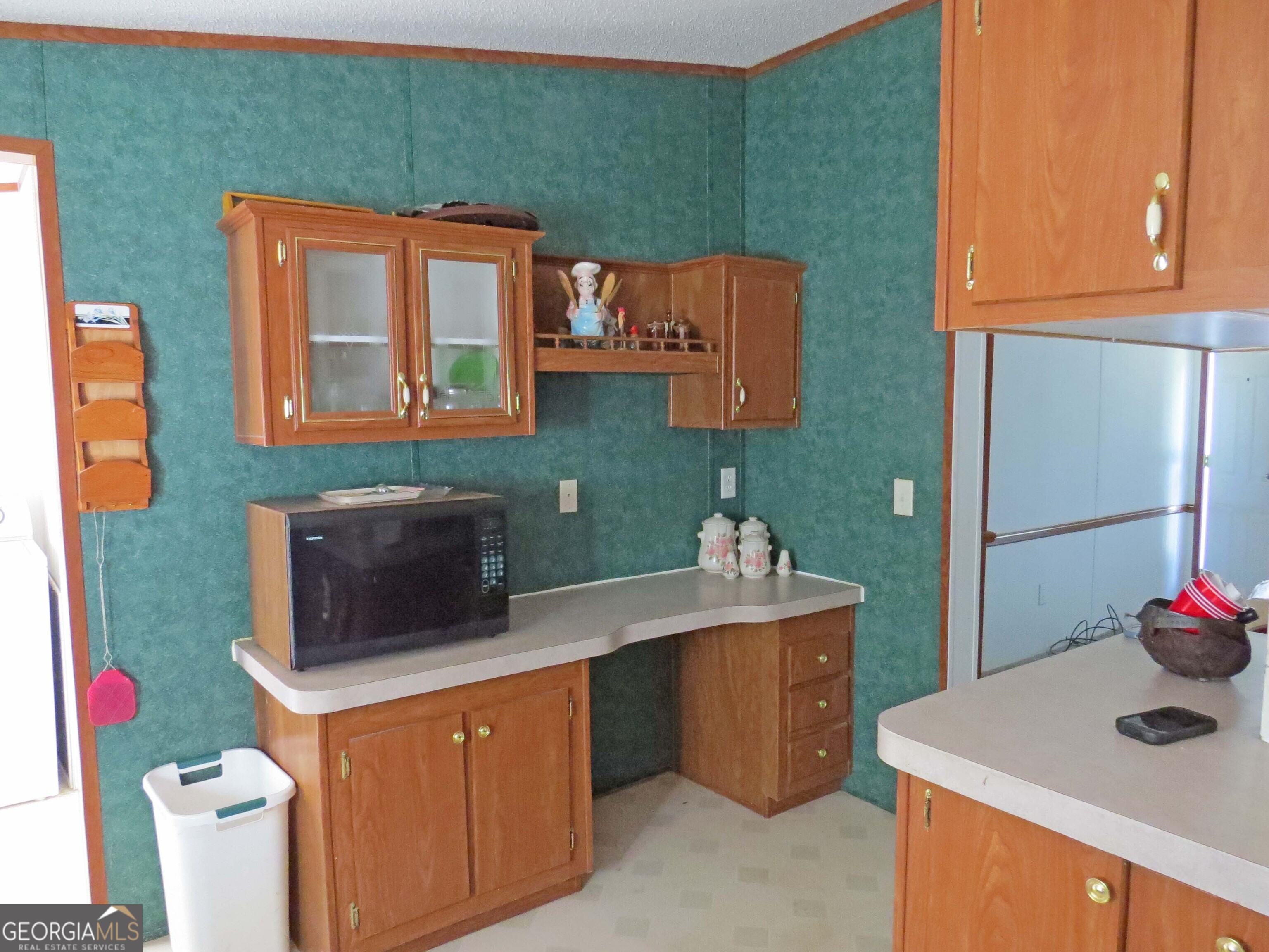 241 Mount Galilee Church Road Jacksonville, GA 31544 - Photo 3 of 19 a kitchen with a stove a sink and a microwave