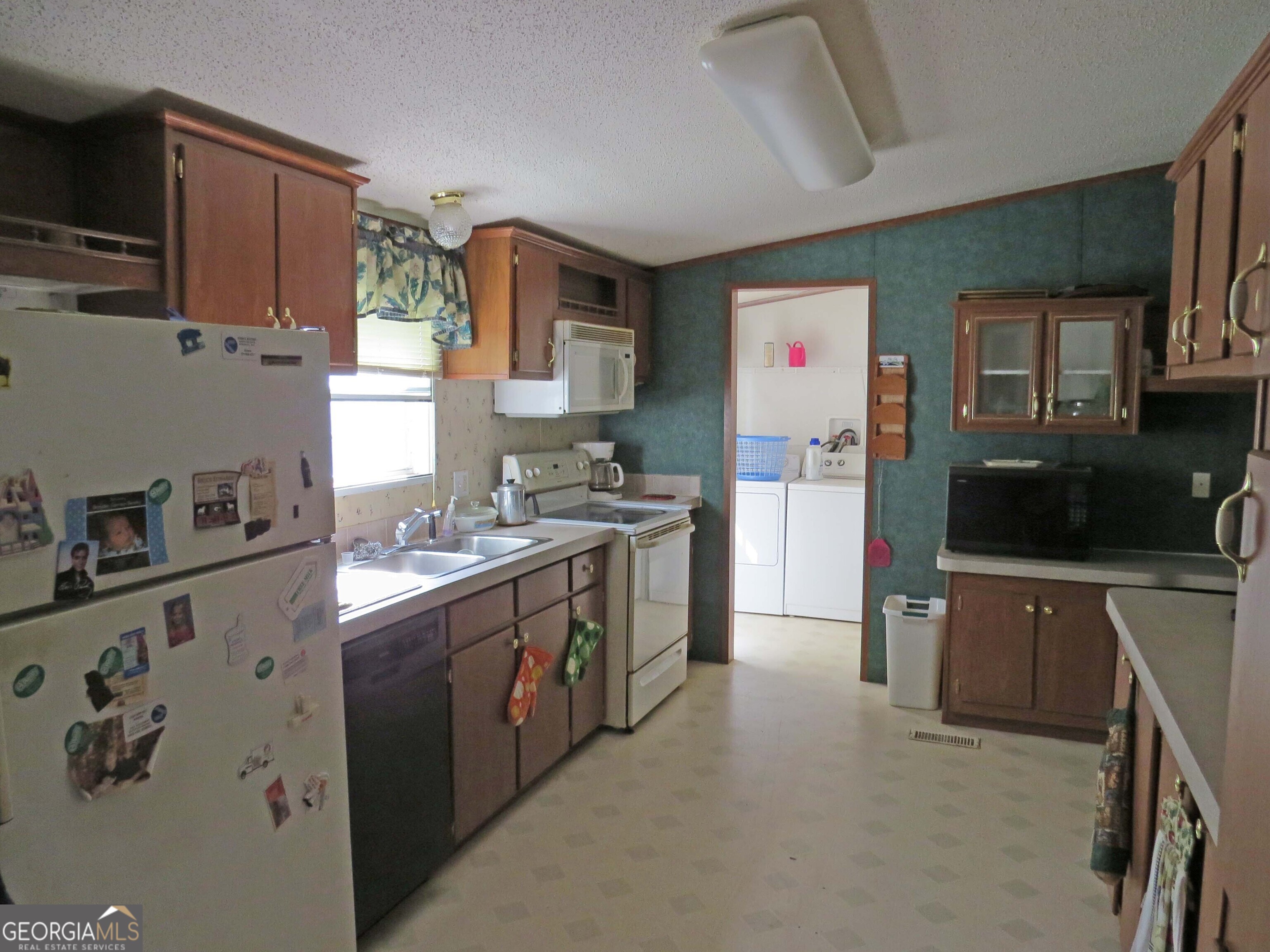 241 Mount Galilee Church Road Jacksonville, GA 31544 - Photo 4 of 19 a kitchen with stainless steel appliances granite countertop a stove a sink dishwasher and a refrigerator
