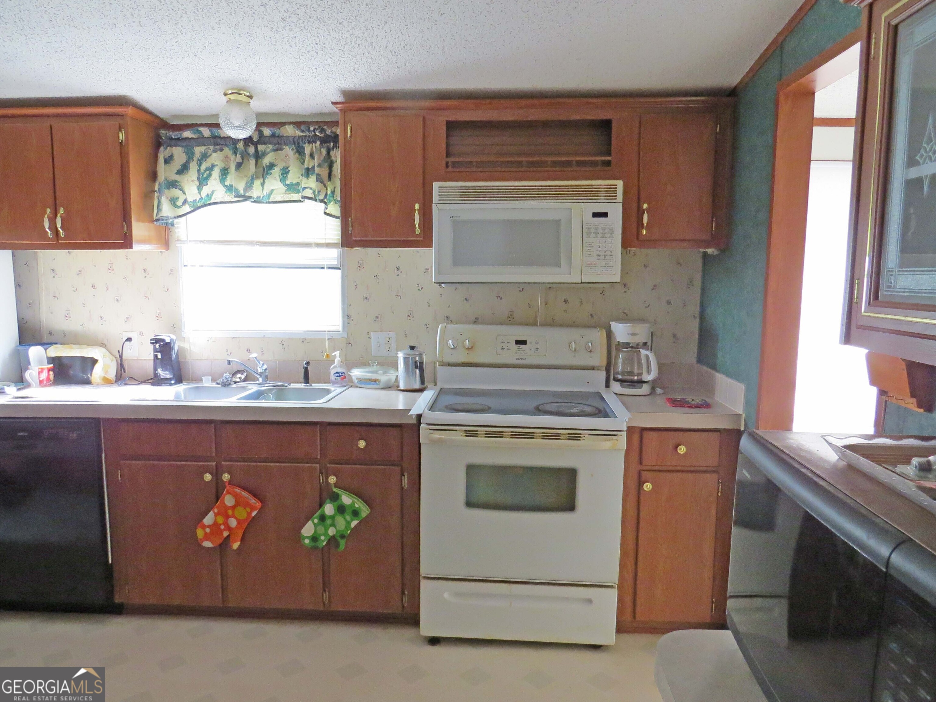 241 Mount Galilee Church Road Jacksonville, GA 31544 - Photo 7 of 19 a kitchen with a stove and a sink