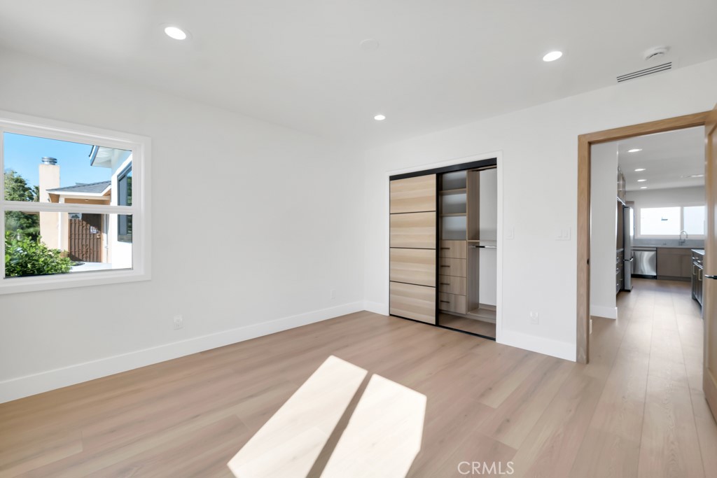 6156 Colbath Avenue Valley Glen, CA 91401 - Photo 14 of 62 wooden floor in an empty room with a window