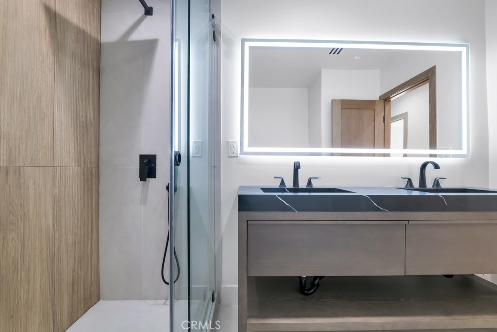 6156 Colbath Avenue Valley Glen, CA 91401 - Photo 20 of 62 a bathroom with a sink and a mirror