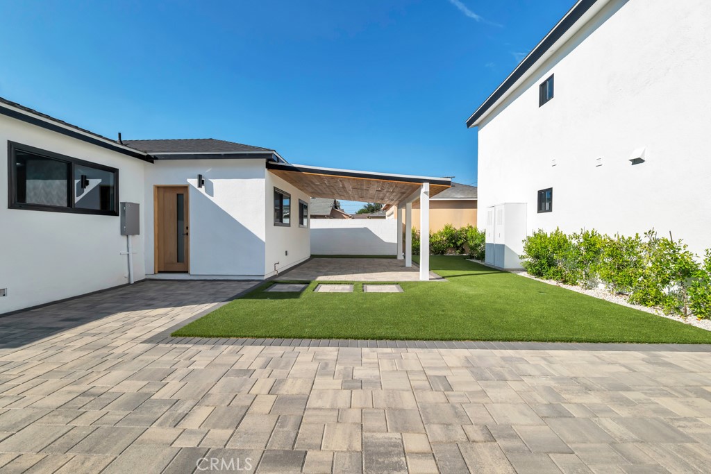 6156 Colbath Avenue Valley Glen, CA 91401 - Photo 27 of 62 a front view of a house with a yard and garage
