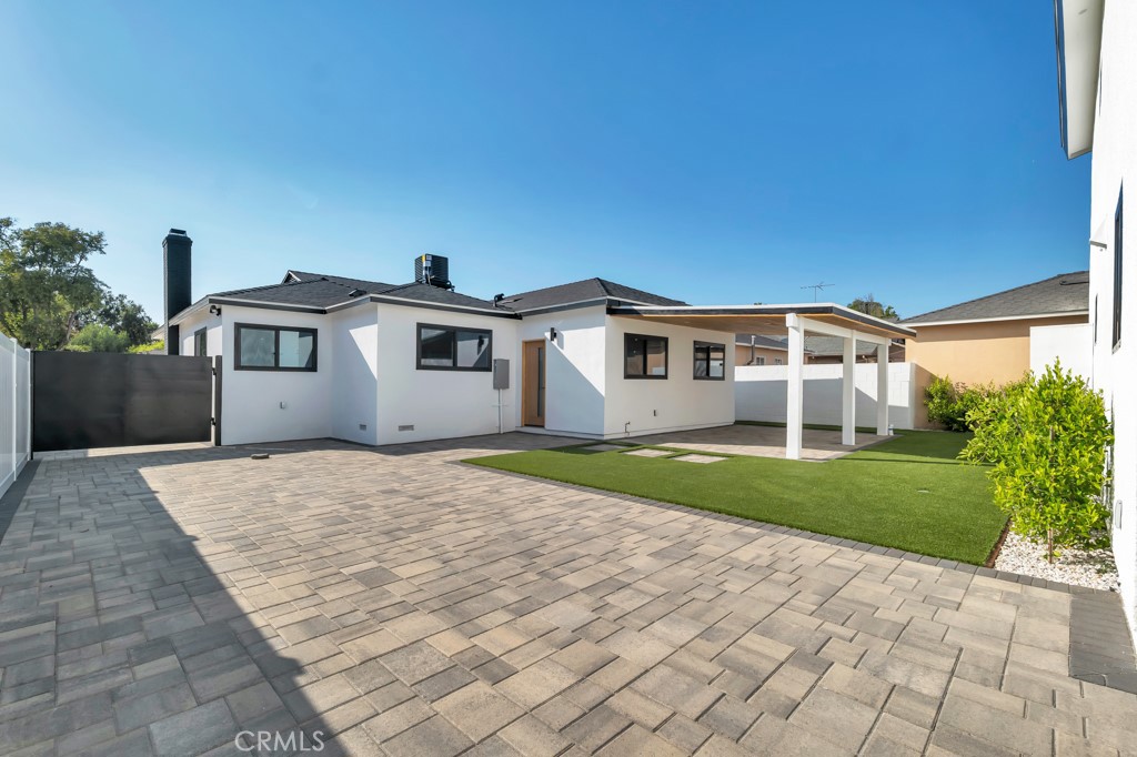 6156 Colbath Avenue Valley Glen, CA 91401 - Photo 30 of 62 a front view of a house with a yard and garage