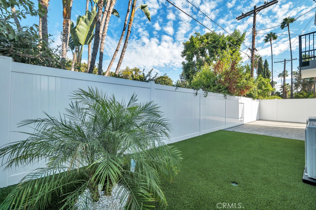 6156 Colbath Avenue Valley Glen, CA 91401 - Photo 32 of 62 a view of a backyard with plants and a large tree