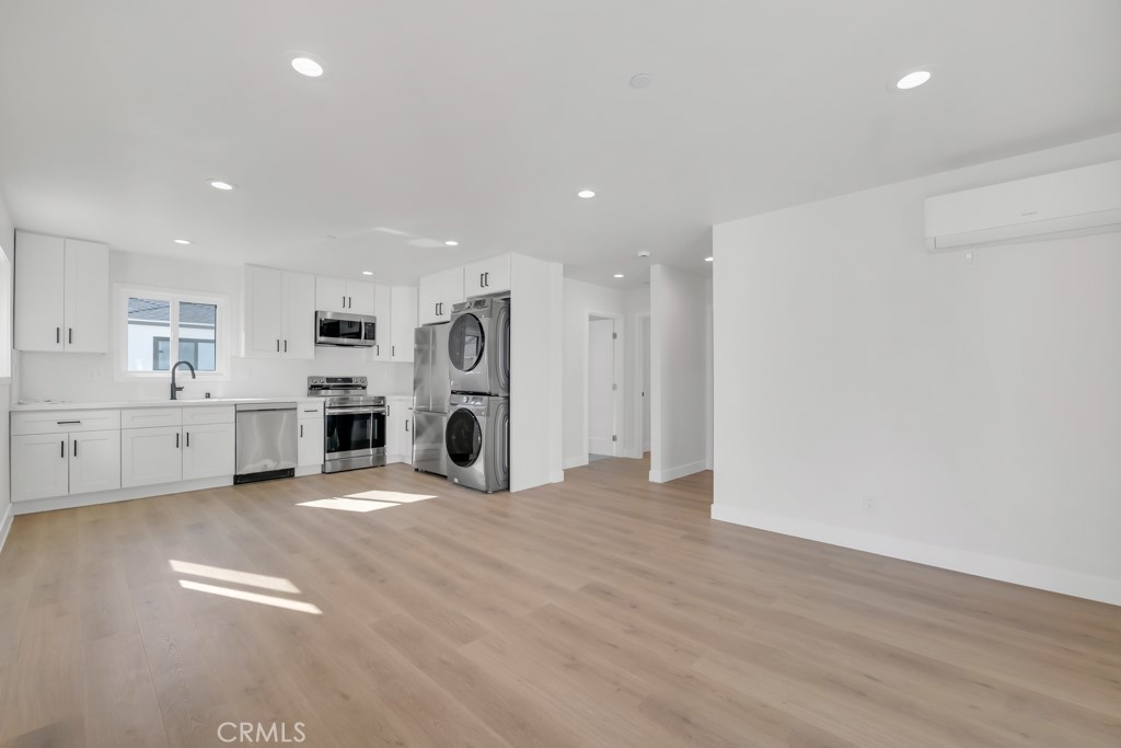 6156 Colbath Avenue Valley Glen, CA 91401 - Photo 33 of 62 a view of a kitchen with stainless steel appliances a refrigerator and a stove top oven