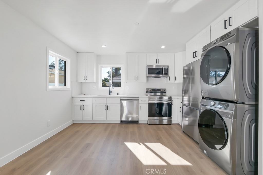6156 Colbath Avenue Valley Glen, CA 91401 - Photo 35 of 62 a view of kitchen with sink a washer and dryer