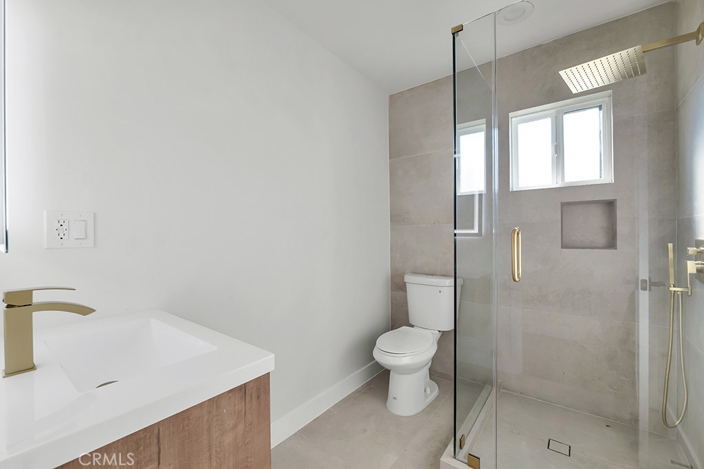 6156 Colbath Avenue Valley Glen, CA 91401 - Photo 36 of 62 a bathroom with a sink toilet and shower