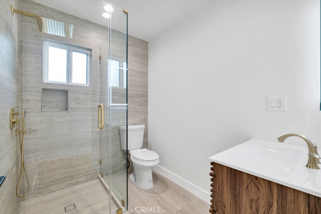 6156 Colbath Avenue Valley Glen, CA 91401 - Photo 39 of 62 a bathroom with a sink toilet and shower