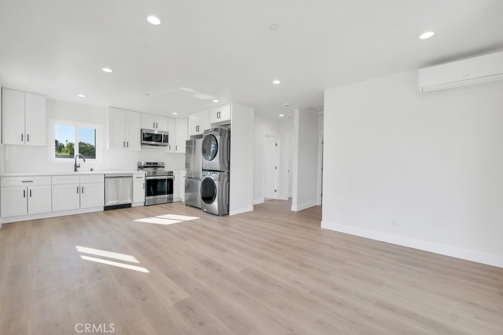 6156 Colbath Avenue Valley Glen, CA 91401 - Photo 40 of 62 a view of a kitchen with a sink and a stove top oven