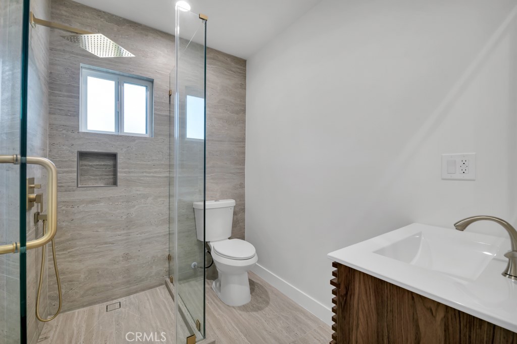 6156 Colbath Avenue Valley Glen, CA 91401 - Photo 45 of 62 a bathroom with a sink toilet and shower