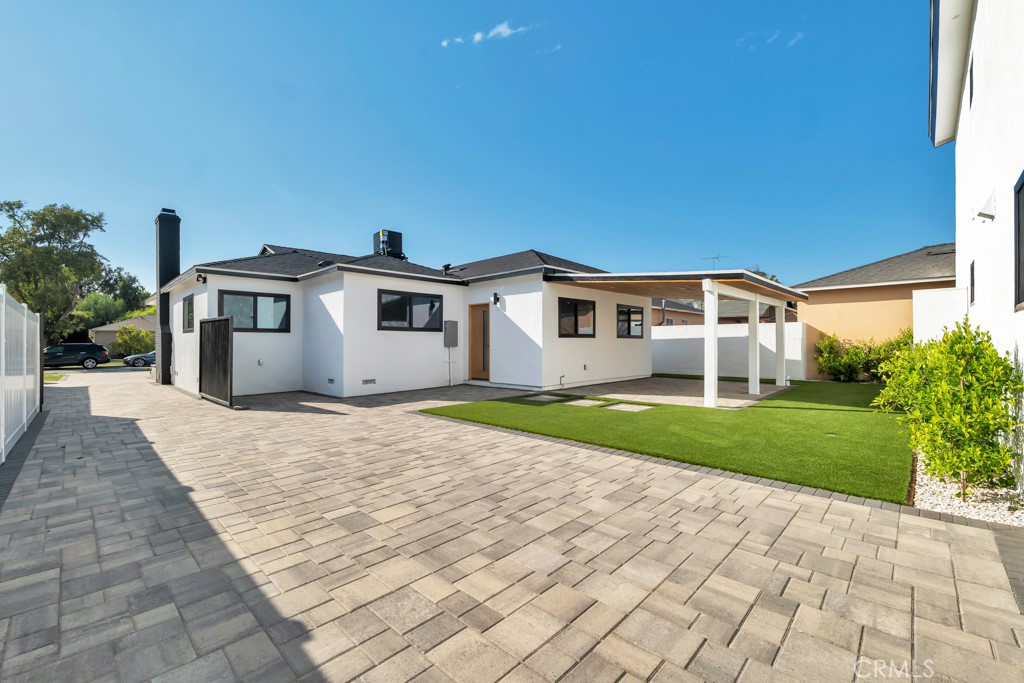6156 Colbath Avenue Valley Glen, CA 91401 - Photo 47 of 62 a front view of a house with a yard and garage