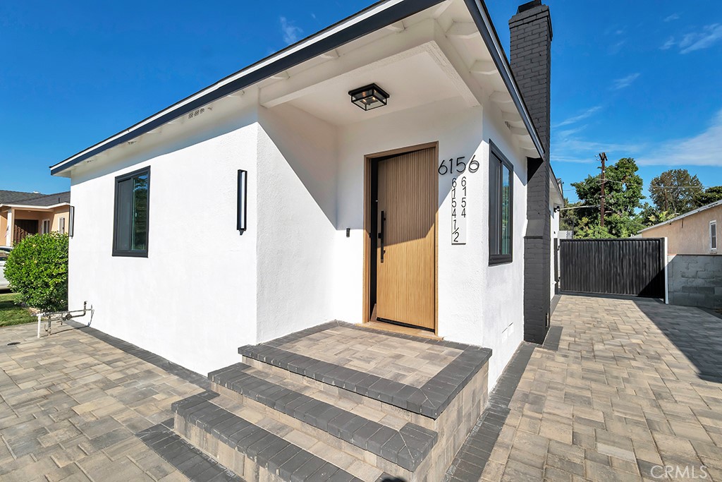 6156 Colbath Avenue Valley Glen, CA 91401 - Photo 5 of 62 a front view of a house with a white door