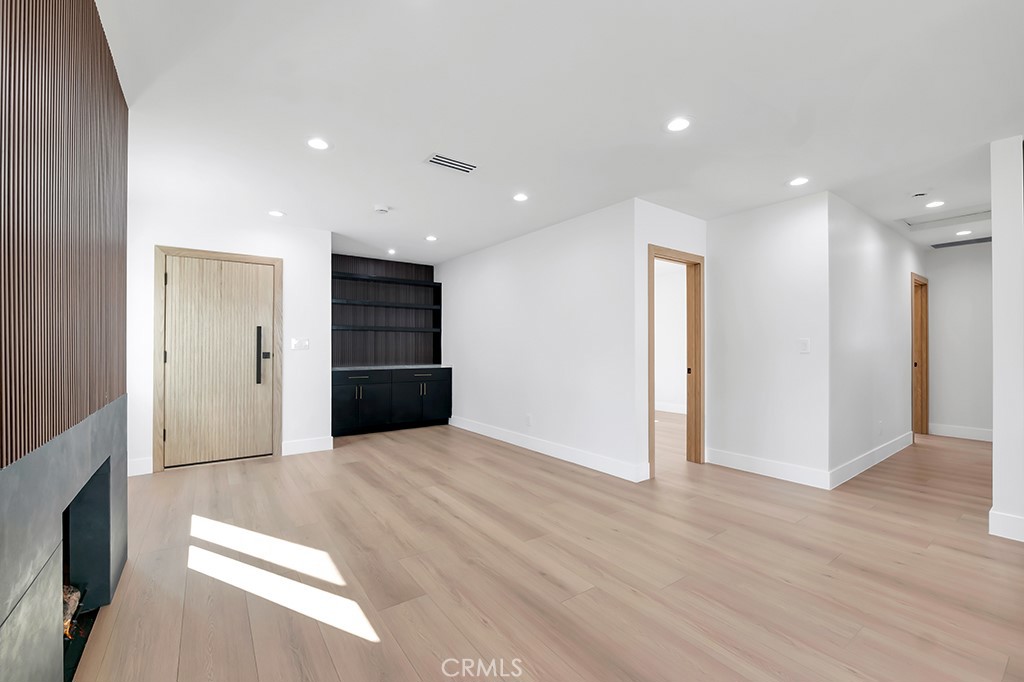 6156 Colbath Avenue Valley Glen, CA 91401 - Photo 7 of 62 a view of an empty room with wooden floor and closet