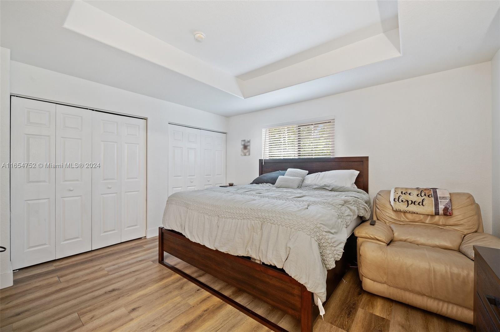 3822 Tree Top Drive Weston, FL 33332 - Photo 17 of 37 a bedroom with a bed and a couch