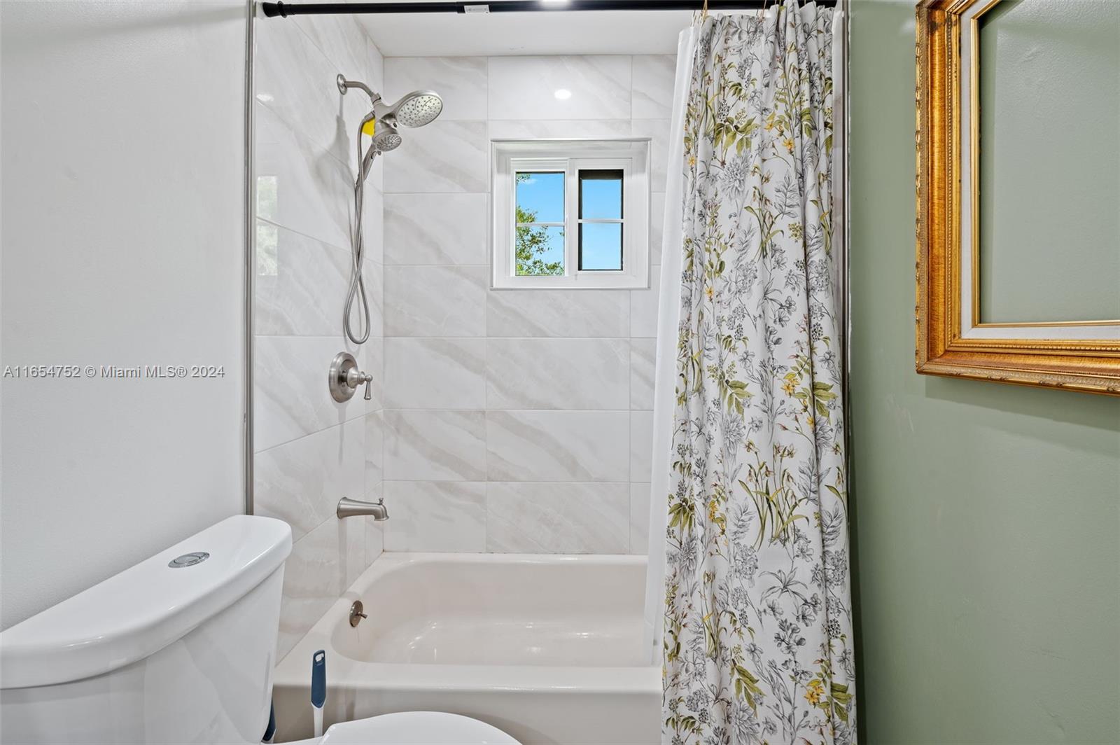 3822 Tree Top Drive Weston, FL 33332 - Photo 24 of 37 a bathroom with a toilet and shower