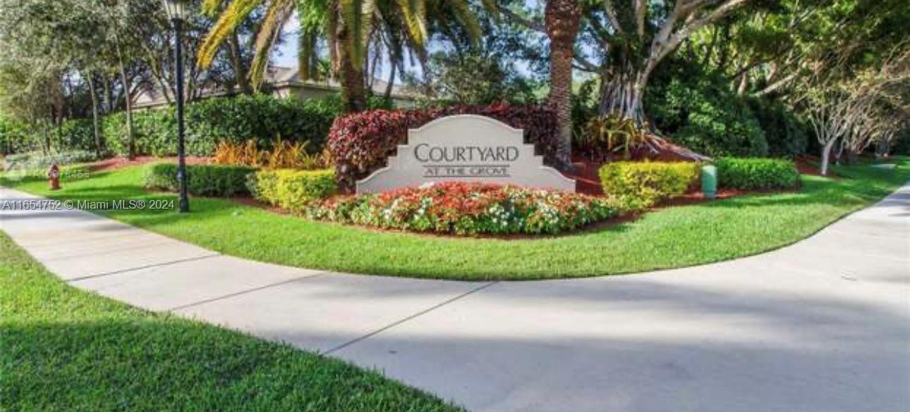 3822 Tree Top Drive Weston, FL 33332 - Photo 36 of 37 a view of a garden with a fountain