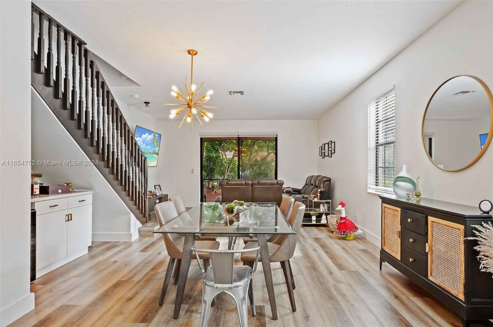 3822 Tree Top Drive Weston, FL 33332 - Photo 5 of 37 a dining room with furniture entryway and wooden floor