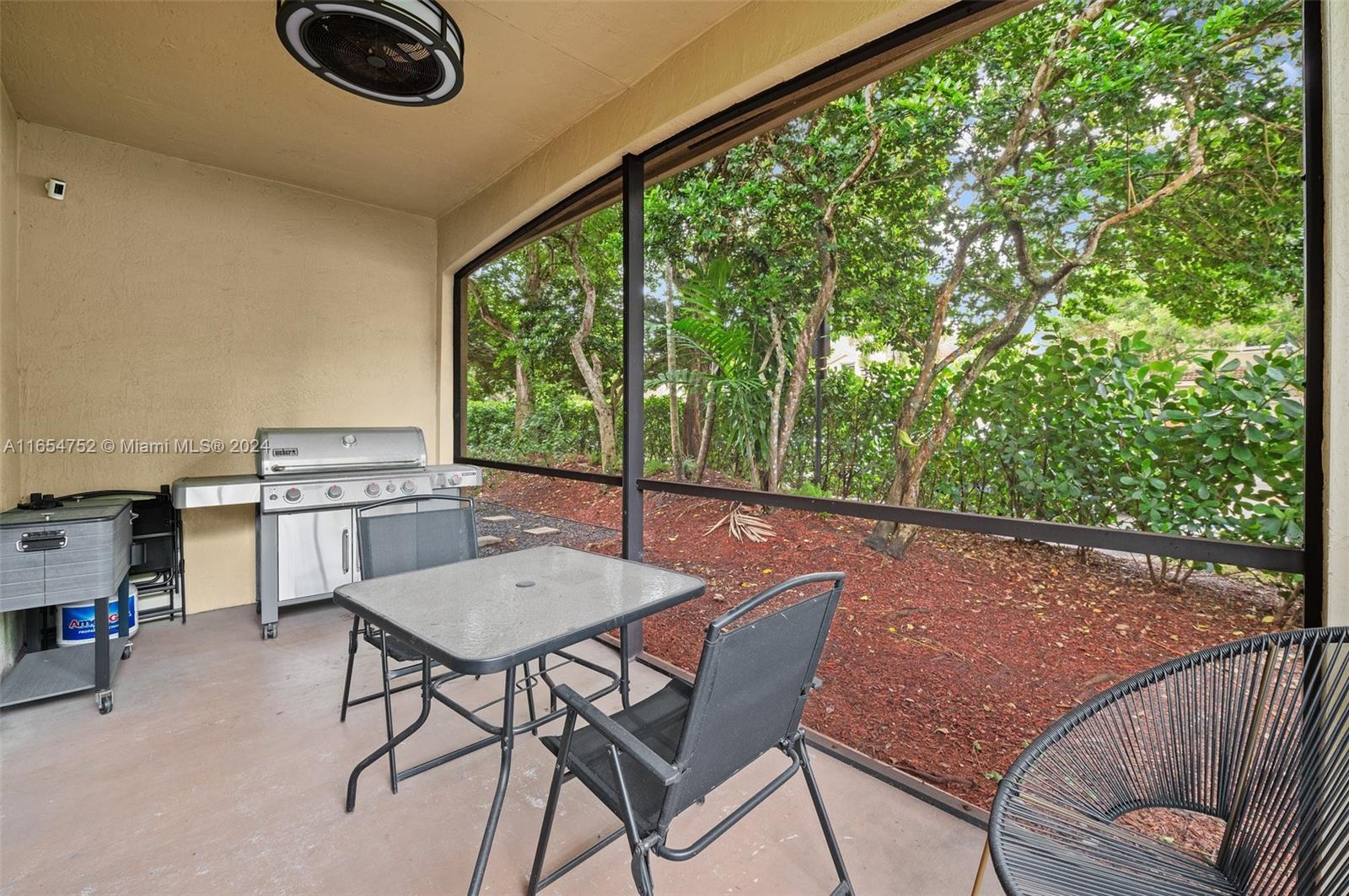 3822 Tree Top Drive Weston, FL 33332 - Photo 9 of 37 a view of a chairs and table in patio