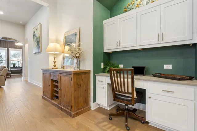 a kitchen with granite countertop cabinets