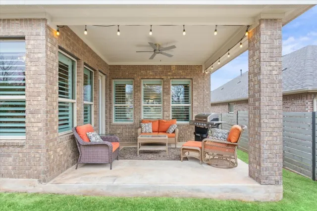 a view of a house with a yard porch and sitting area