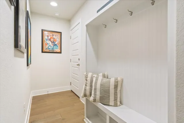 a living room with furniture and floor to ceiling windows
