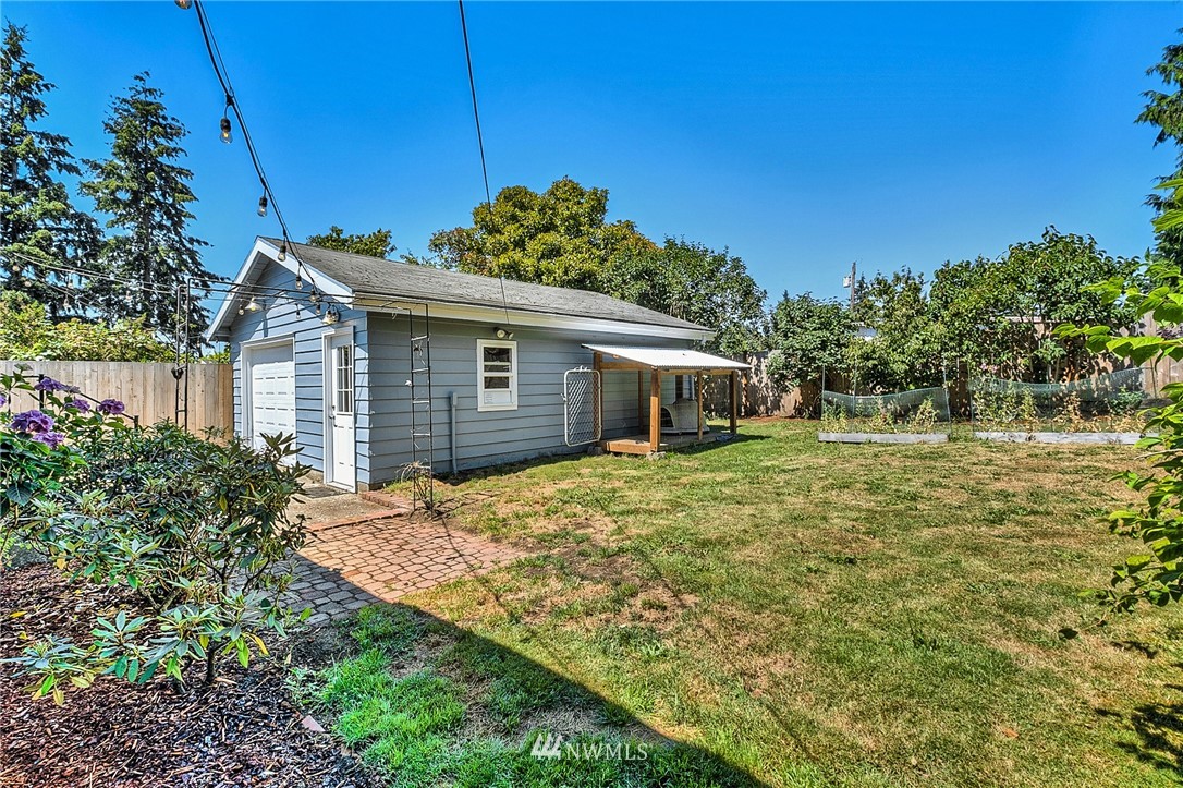 2216 Northeast 8th Place Renton, WA 98056 - Photo 3 of 24 a front view of a house with a garden
