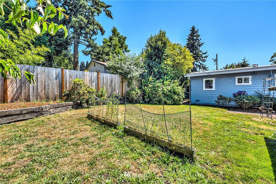 2216 Northeast 8th Place Renton, WA 98056 - Photo 23 of 24 a view of a backyard with a small pool and plants