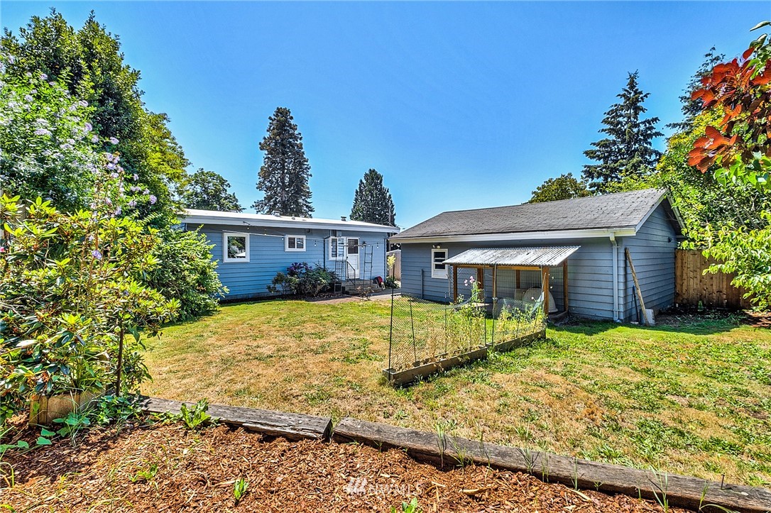 2216 Northeast 8th Place Renton, WA 98056 - Photo 4 of 24 a view of a house with a yard