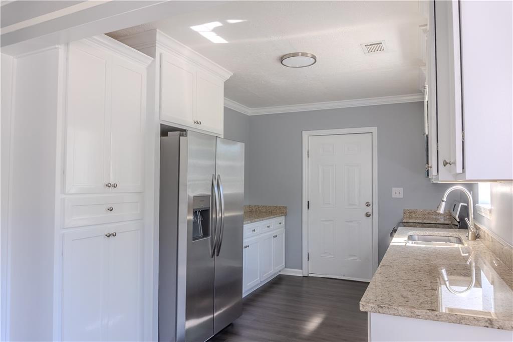 53 Washington Drive Forsyth, GA 31029 - Photo 6 of 19 a kitchen with a refrigerator and a sink