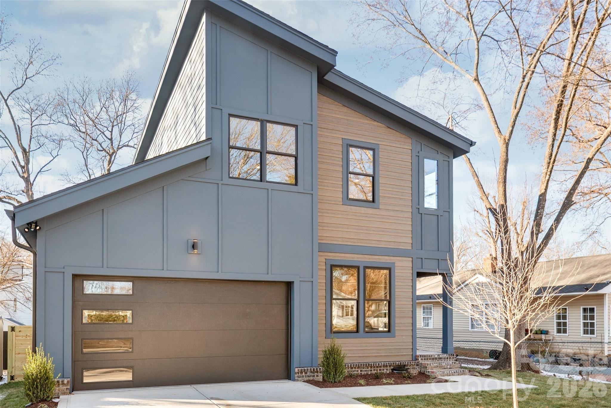 a front view of a house with a garage