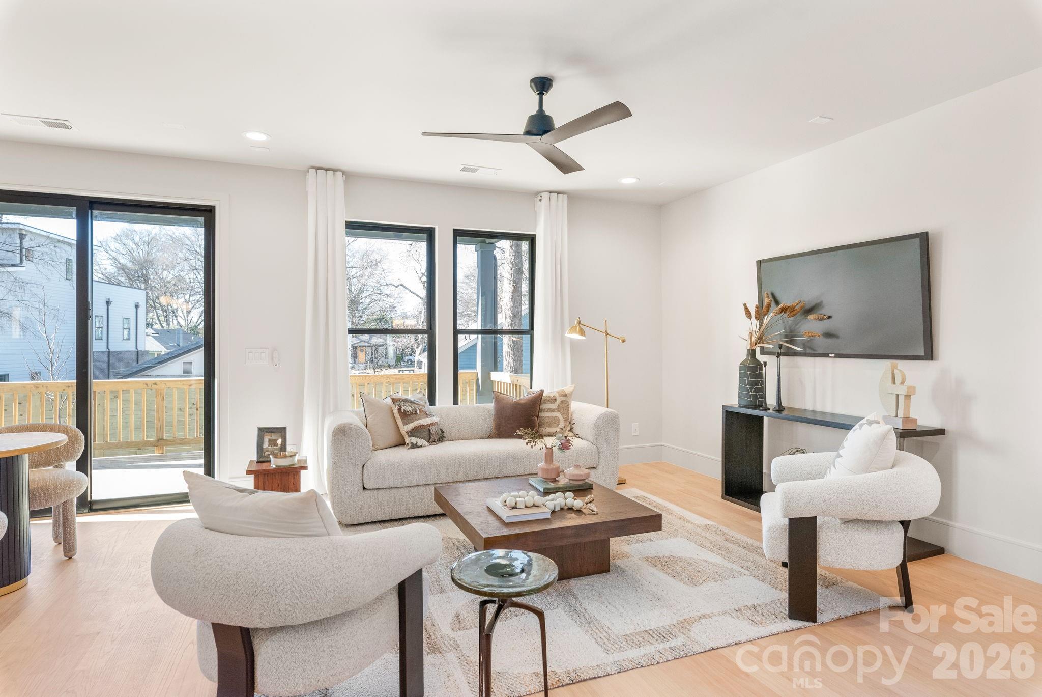 1637 Umstead Street Charlotte, NC 28205 - Photo 17 of 48 a living room with furniture and a large window