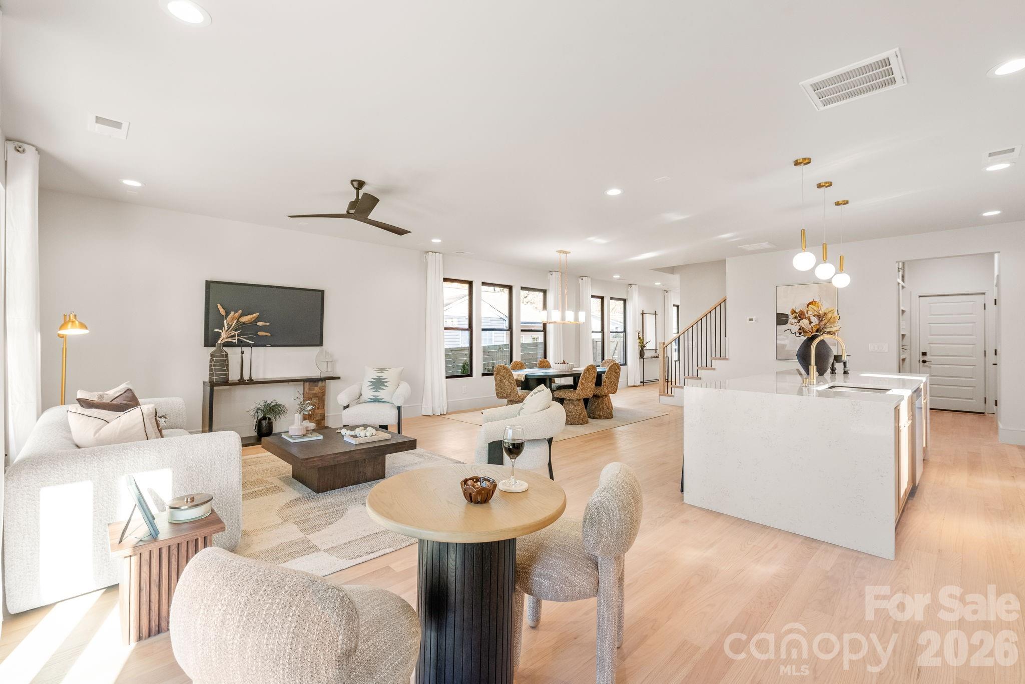 1637 Umstead Street Charlotte, NC 28205 - Photo 22 of 48 a living room with furniture a rug and white walls