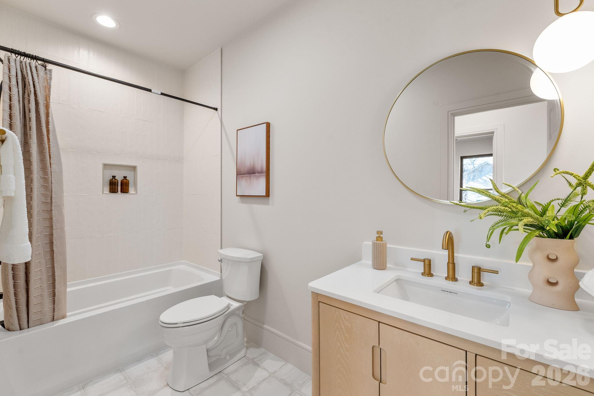 1637 Umstead Street Charlotte, NC 28205 - Photo 26 of 48 a bathroom with a sink a toilet and shower