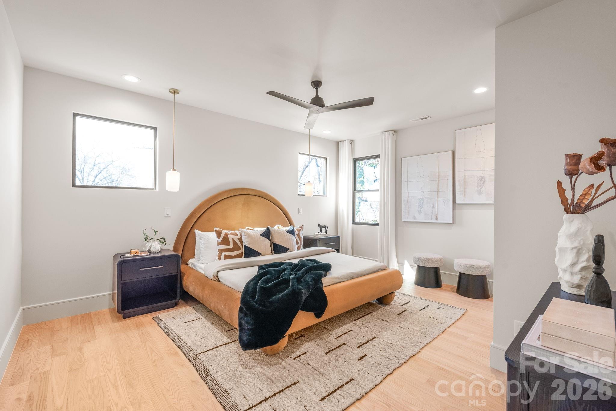 1637 Umstead Street Charlotte, NC 28205 - Photo 29 of 48 a bedroom with a bed and a wooden floor