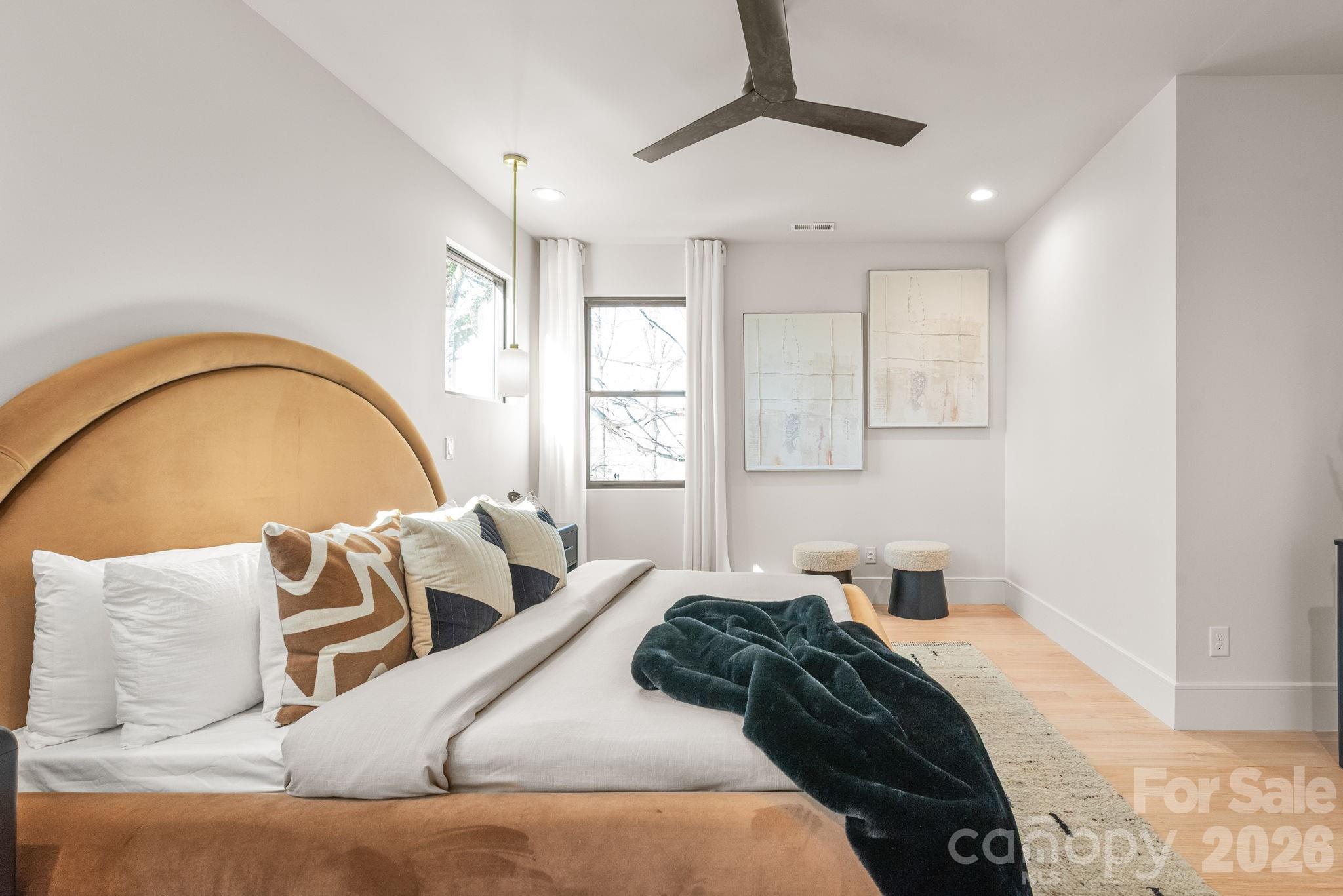 1637 Umstead Street Charlotte, NC 28205 - Photo 30 of 48 a bedroom with a bed and wooden floor