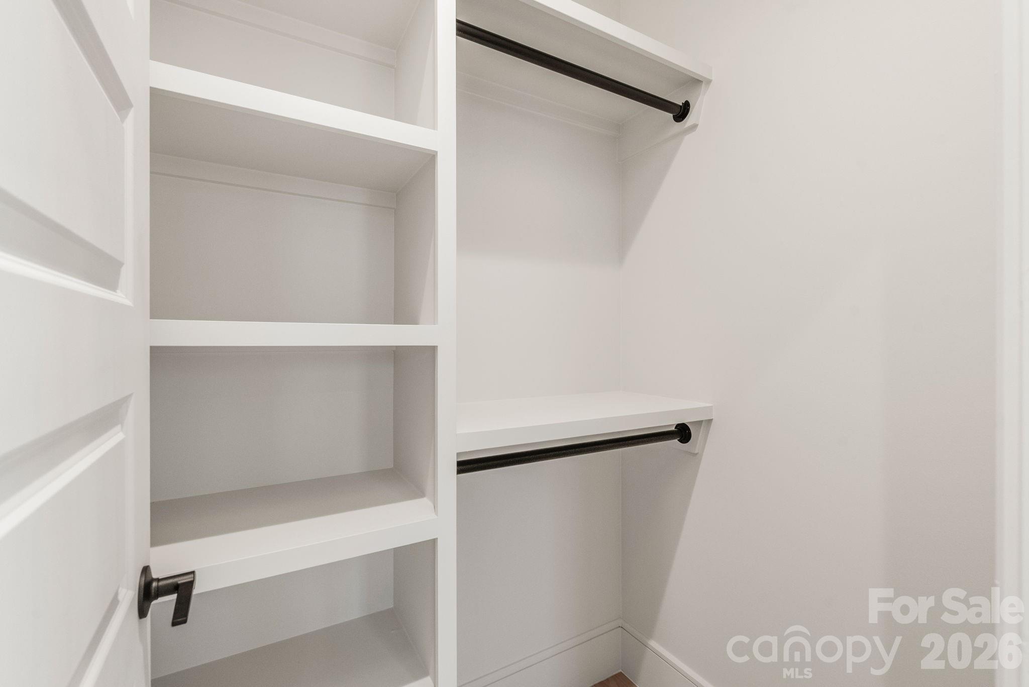 1637 Umstead Street Charlotte, NC 28205 - Photo 38 of 48 a view of walk in closet with empty racks