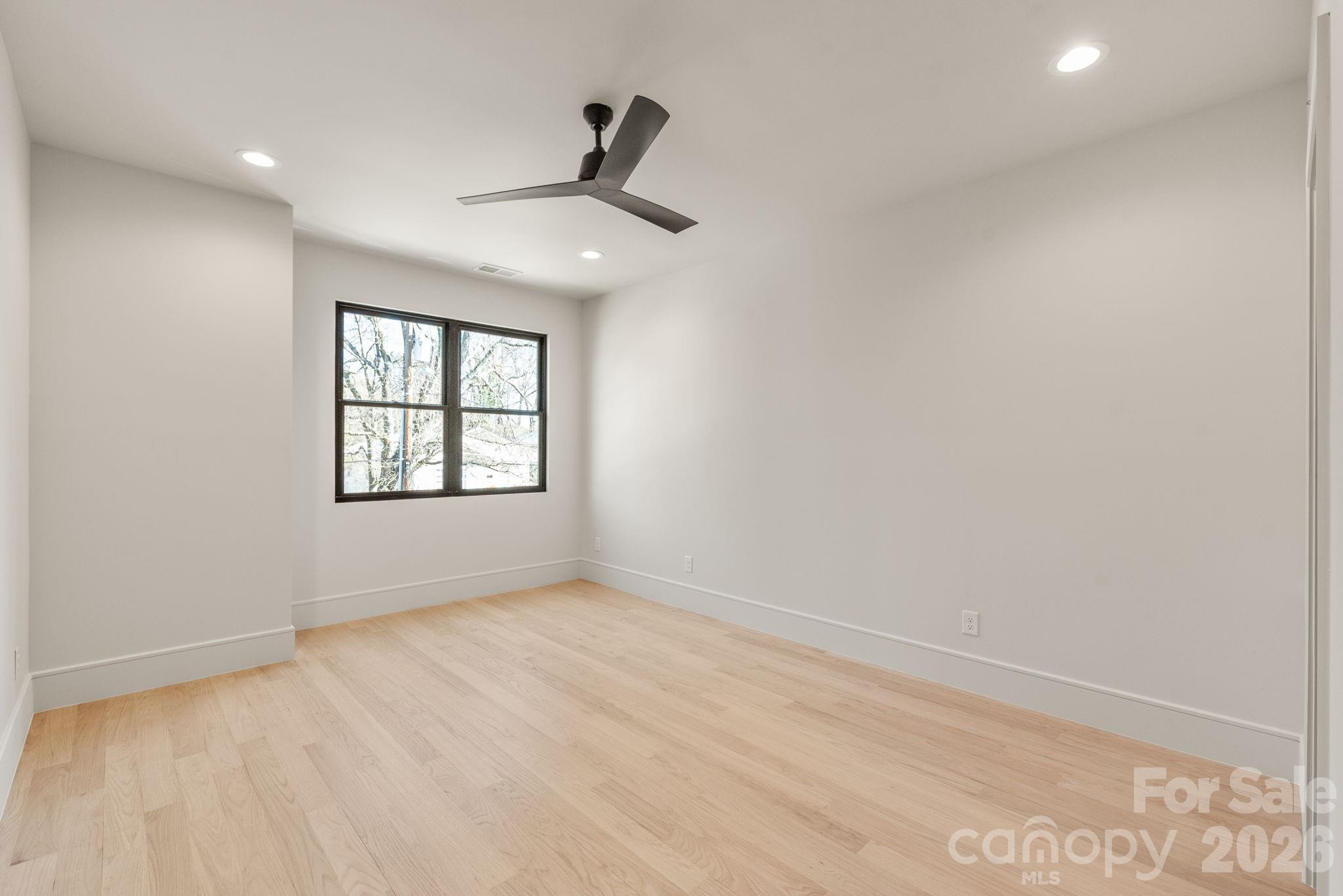 1637 Umstead Street Charlotte, NC 28205 - Photo 39 of 48 wooden floor in an empty room with a window