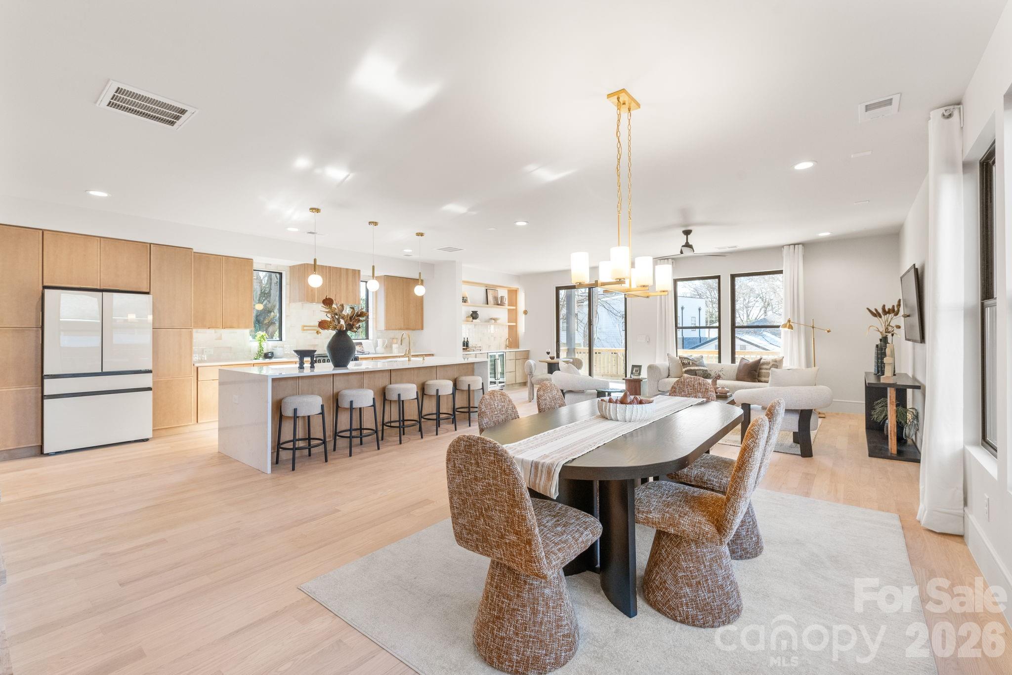 1637 Umstead Street Charlotte, NC 28205 - Photo 9 of 48 a large kitchen with a table and chairs