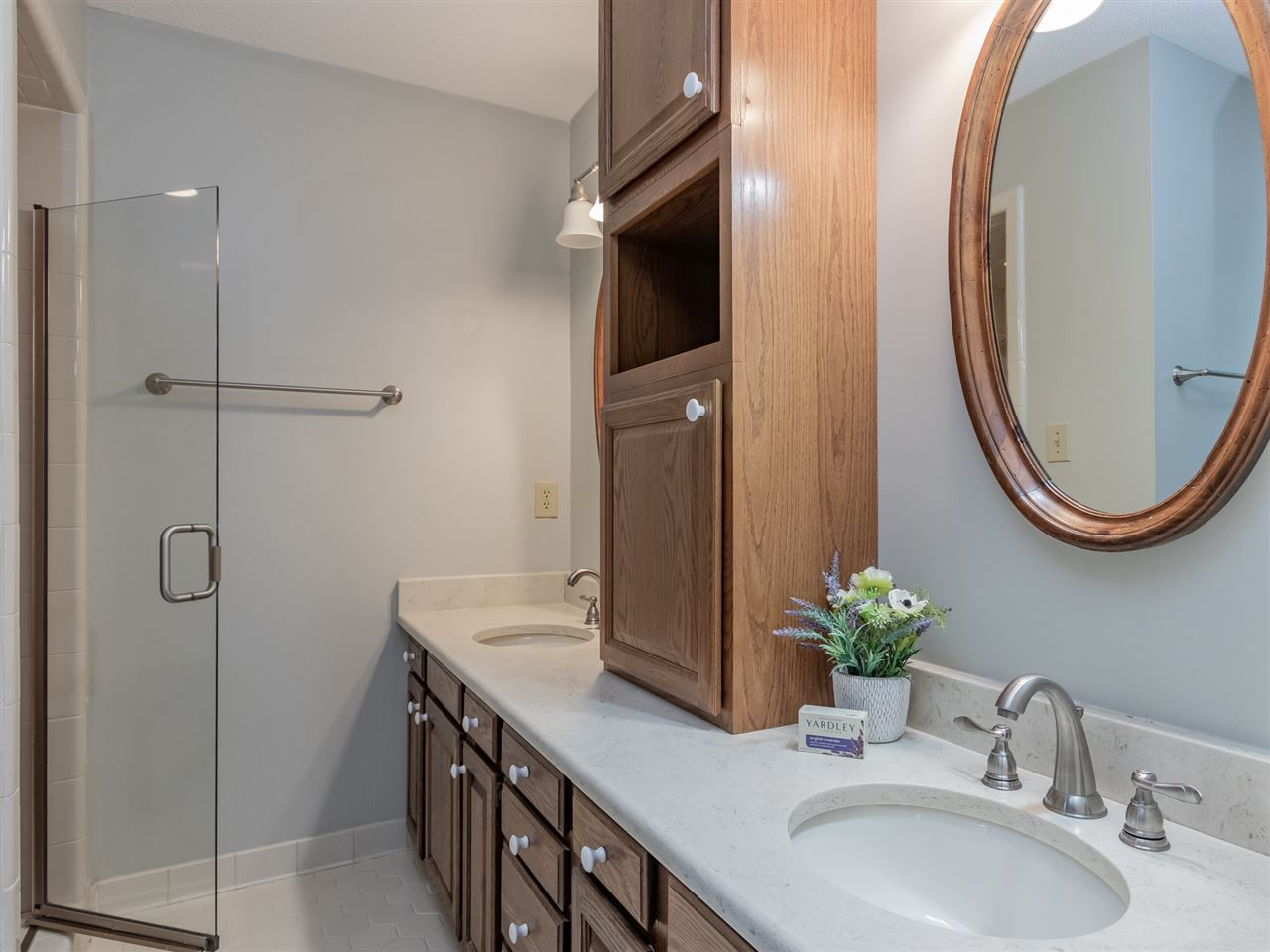 8701 Brandon Station Road Raleigh, NC 27613 - Photo 15 of 30 Quarts counter tops with storage and walk-in shower. Master Bath