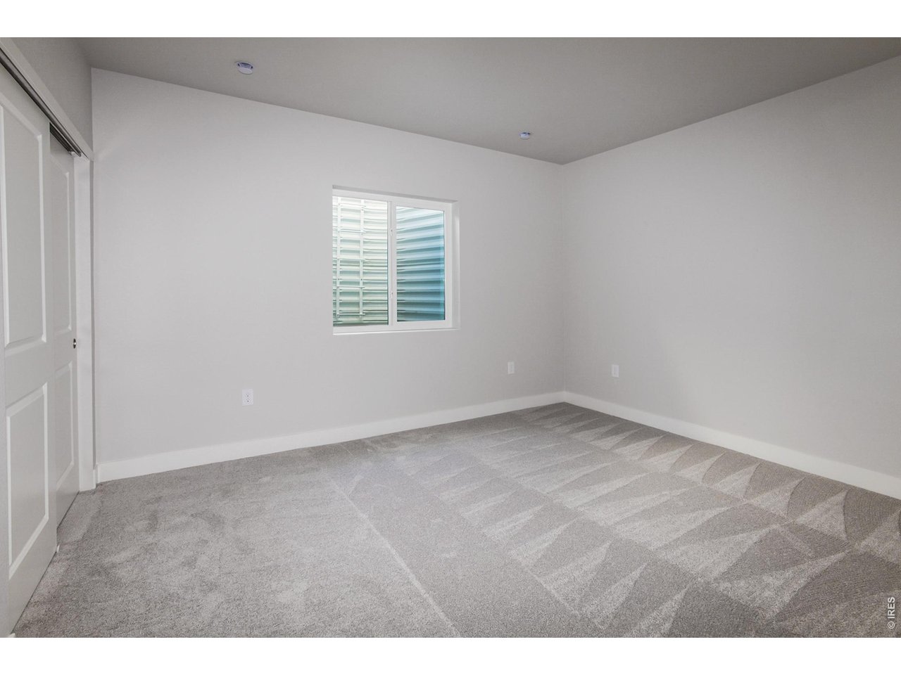 792 Chatter Road Windsor, CO 80550 - Photo 35 of 49 a view of an empty room with a window