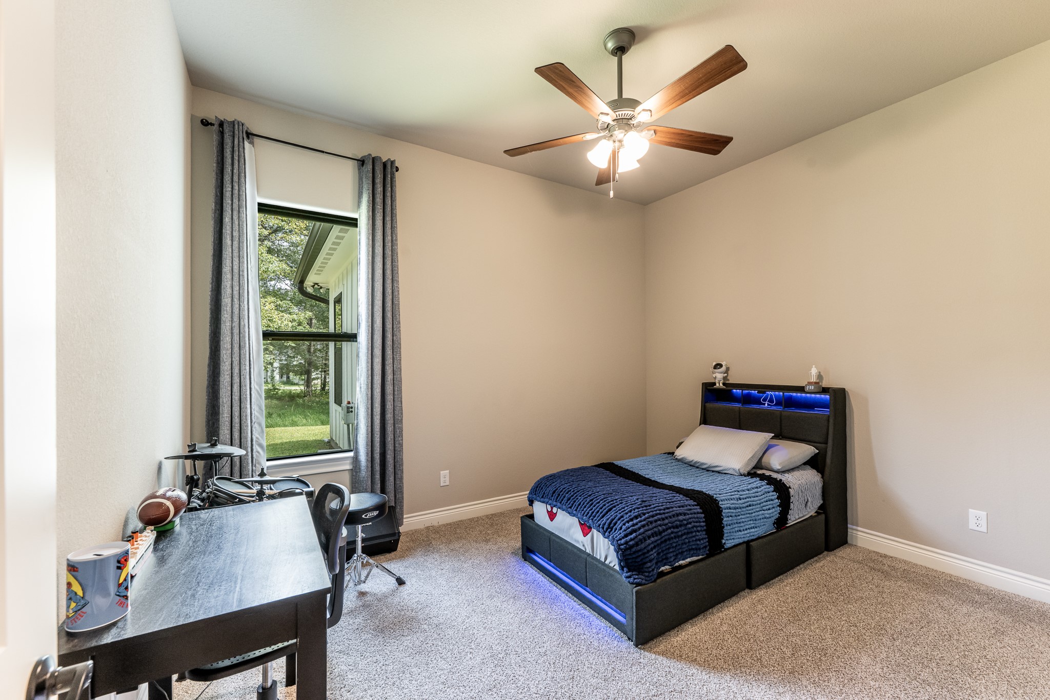 111 Eagle Run Road Willis, TX 77378 - Photo 25 of 44 Secondary bedrooms offer privacy, located opposite the primary suite.