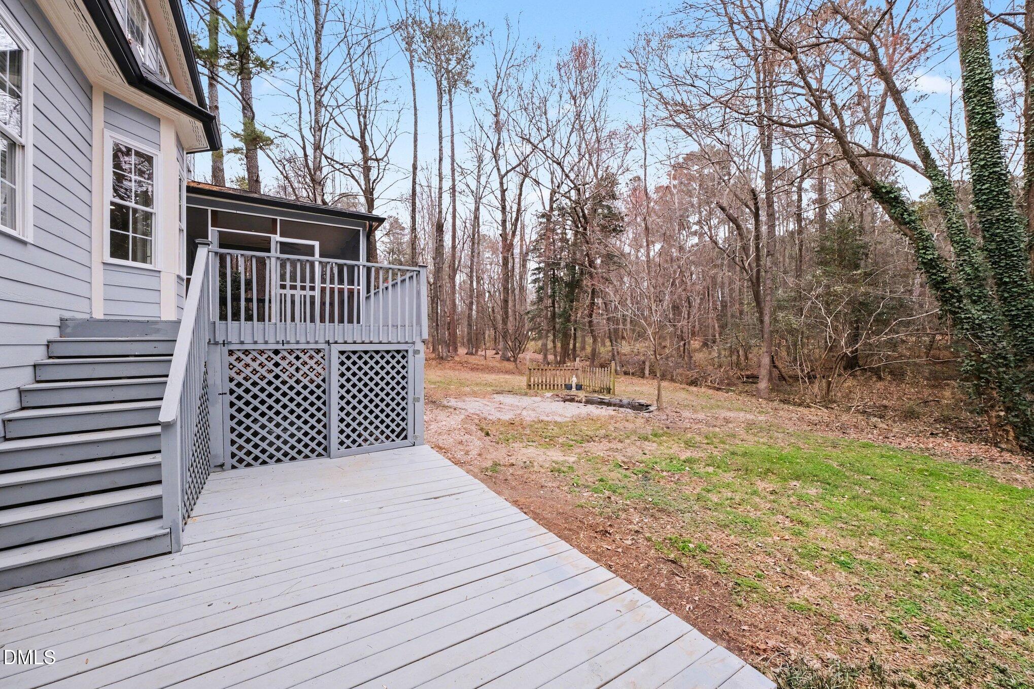4613 Cherrybark Lane Raleigh, NC 27616 - Photo 19 of 27 a side view of a house with a yard