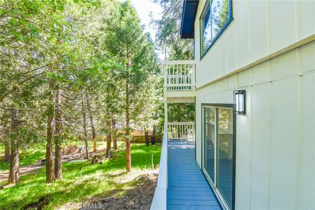 a view of a porch with a floor to ceiling window