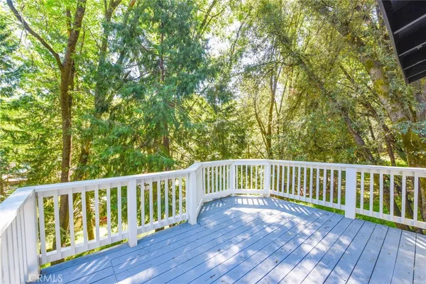 a view of balcony with wooden floor