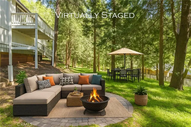 a view of a green field with wooden fence